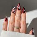 Christmas Red Press on Nails Short Almond Fake Nails Holiday Nails Press ons with Candy Cane Stripes,Snowflake Design Full Cover Stick on Nail for Women Winter Manicure,Reusable | Easy Apply | 24Pcs