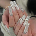 RTKHFZE Long Coffin Press on Nails Cute Acrylic Fake Nails Nude Glitter False Nails with Butterfly Pattern Designs Rhinestone Artificial Nails Full Cover Stick on Nail for Women 24Pcs