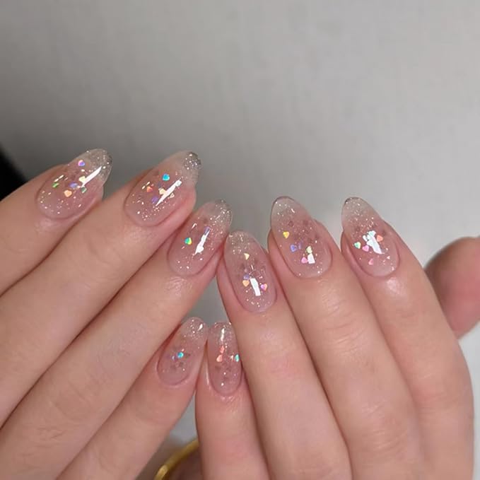 Cute Pink Glitter Press On Nails Almond Shape – Medium Length Nude Gradient Acrylic Fake Nails with Iridescent Hearts & Confetti, 24Pcs Glossy Stick On Nails Kit with Glue for Girls & Women Party