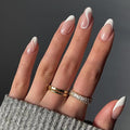 White French Tip Press on Nails Medium Almond Fake Nails Nude False Nails Press ons with Swirl Wave Line Designs Glossy Full Cover Glue on Nails Acrylic Stick on Nail for Women Manicure 24Pcs
