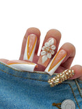 Euphrosyne Elegant Press On Nails – 10pcs Long Almond Fake Nails in Nude Peach with Gold French Tips, 3D Floral Designs & Rhinestone Accents.