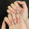 Valentine‘s Day Leopard Print Press on Nails - Gold Glitter French Tip & Bow Design, Medium Almond Nude Gradient Acrylic Fake Nails for Women (Sweet Leopard Chic, S)